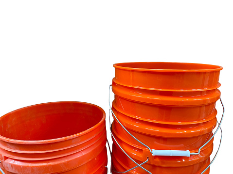 Stack of orange buckets isolated on white background
