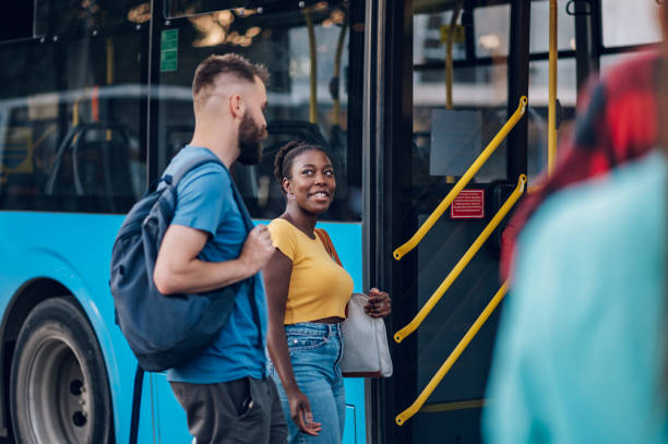 istock Multiracial friends waiting public transportation on a bus stop 1468670191