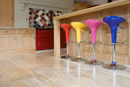 Some retro colorful chairs at a kitchen bar