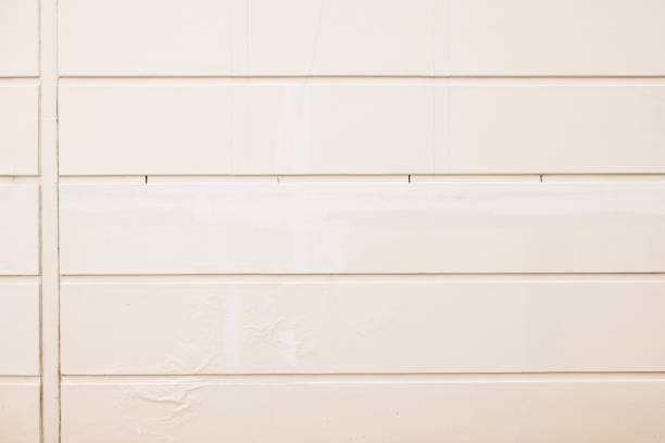 Part of a beige concrete wall with channels.