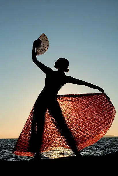 silhouette of spanish dancer on beach