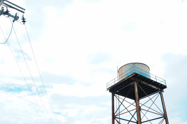 istock Looking up at the rusty old water tower from below against the cloudless blue sky with copy space 1468676688