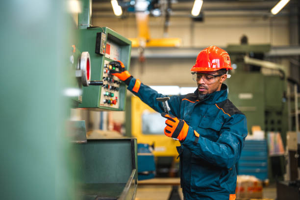 istock Black Male Factory Worker Checking Product Quality 1468676828