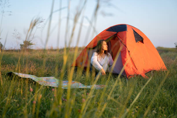istock Eco mind. Woman camping in nature. 1468676840