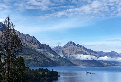 The TSS Earnslaw twin-screw steamer glides along Lake Wakatipu in Queenstown, New Zealand.