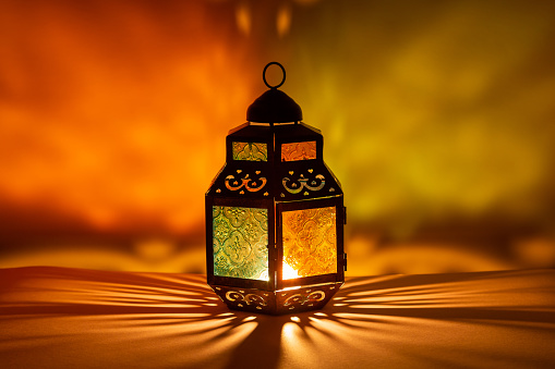 Traditional Arabic lantern lit up for celebrating the Holy Month of Ramadan. High resolution photo.