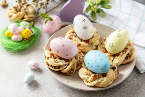 istock Easter composition. Sweet Italian Easter Bread Rings from puff pastry and dyed eggs on a stone background. 1468678482
