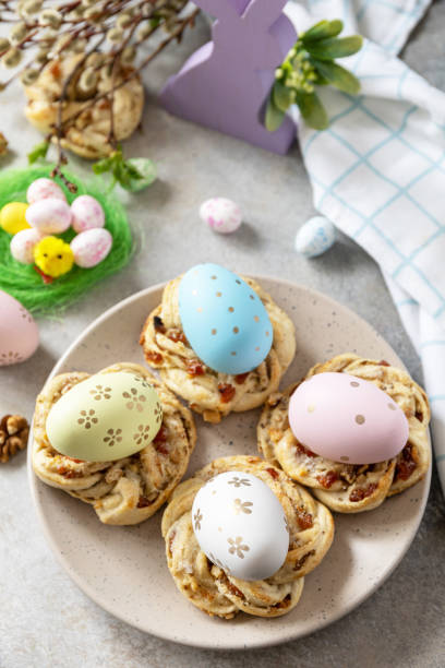istock Easter composition. Sweet Italian Easter Bread Rings from puff pastry and dyed eggs on a stone background. 1468678488