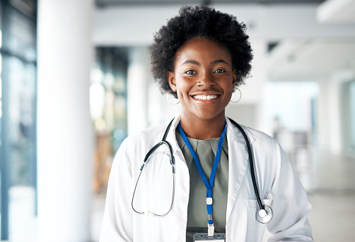 Portrait of a black woman doctor happy with internship opportunity, healthcare career and hospital values. Face or headshot of young medical worker, cardiologist or person with clinic services smile