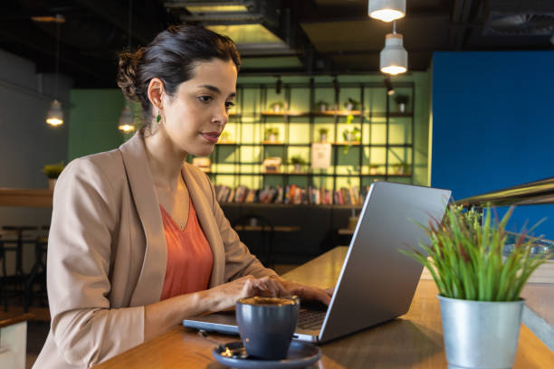 istock Working Out Of The Office In A Cafe 1468678991