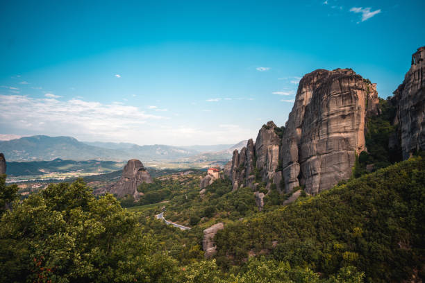 A picture of world famous  rock climbing destination, giant boulders and an open valley behind.