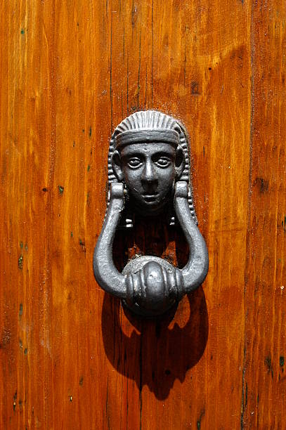 istock metal knocker on a wooden door 146868237