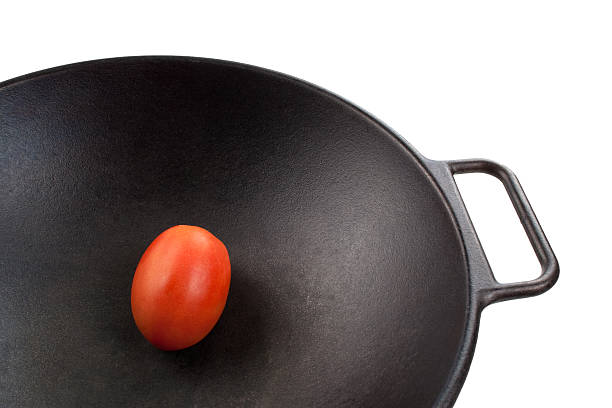 Tomato in Wok stock photo