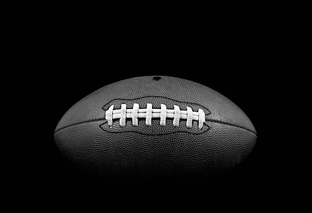 Classic American Football B&W studio shot of American leather football american football ball photos stock pictures, royalty-free photos & images