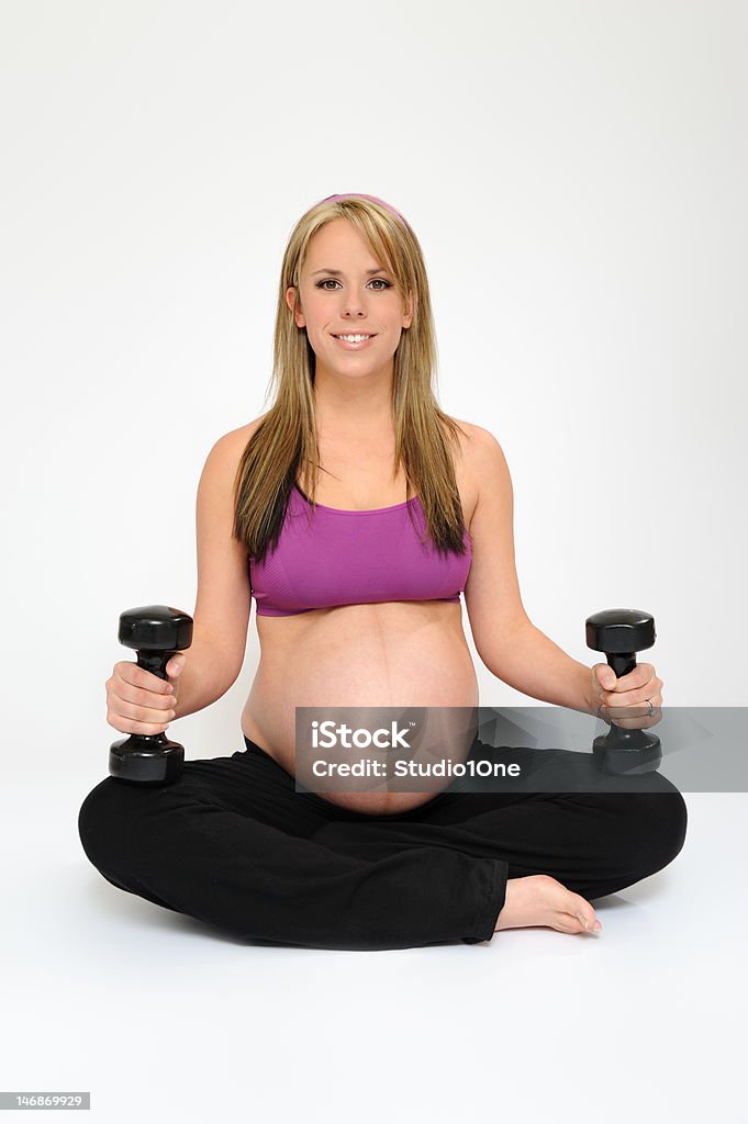 Pregnancy Pregnant girl exercising 20-29 Years Stock Photo