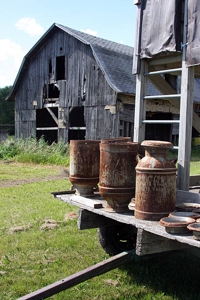 istock vintage milk cans old barn 146870218