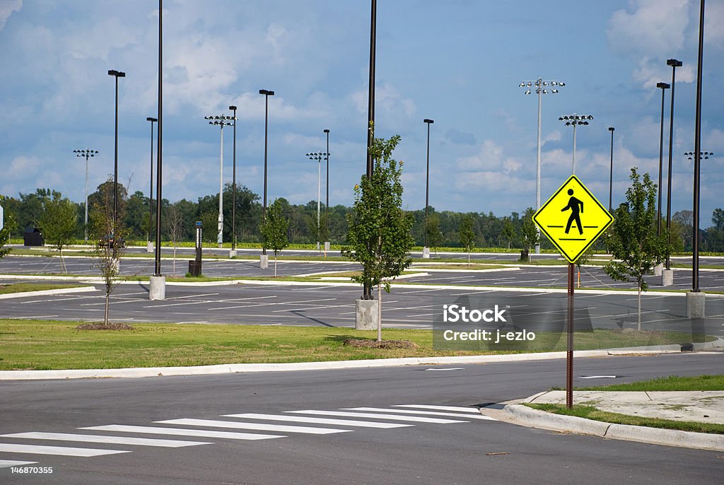 Pedestrian Crossing A pedestrian crosswalk in front of an empty parking lot. Shot in Greenville, North Carolina. Crosswalk Stock Photo