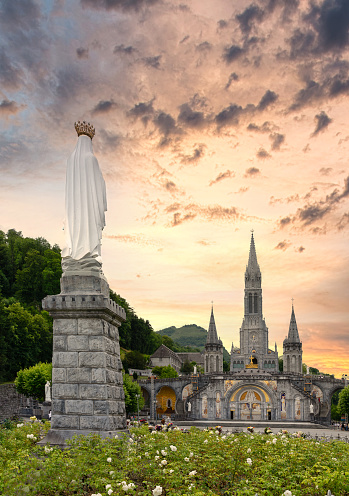 Landscape of the sanctuary of Our Lady in Lourdes at sunset, France -  Religious tourism concept