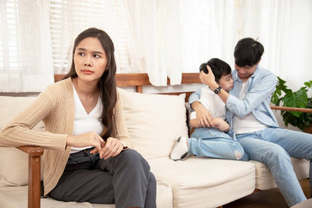 Family Conflicts concept. Young mother serious couple has a family stressful conversation at home. Could you just hear me? family problems Family Conflicts concept. Young mother serious couple has a family stressful conversation at home. Could you just hear me? family problems children divorce stock pictures, royalty-free photos & images
