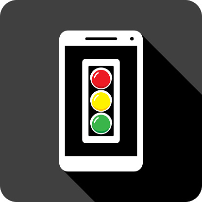 Vector illustration of a smartphone with traffic light icon against a black background in flat style.