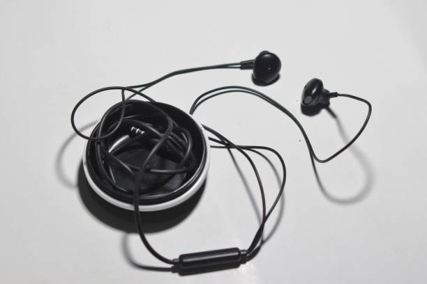 istock a black headset rolled up in a circular headset 1468718616