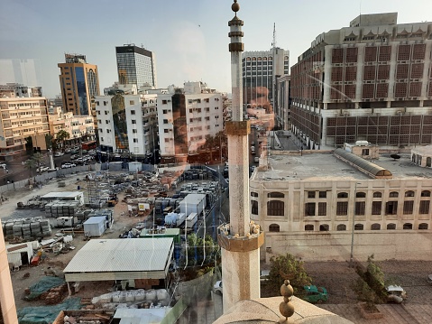 An aerial view of Balad, the commercial center of Jeddah, Saudi Arabia. Mosque minaret, buildings and roads are visible.