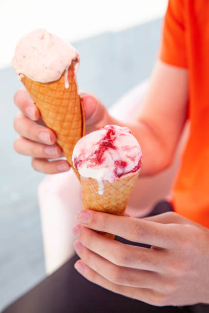 istock Hand holding gelato cone ice cream in two hands 1468726739