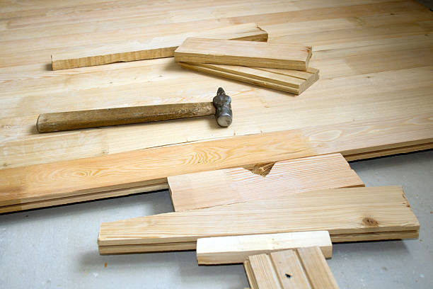 istock Hammer on wooden to a floor 146872819
