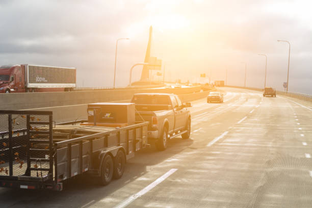 Cleveland, Ohio, USA- 04/21/2023: pickup truck with trailer on highway road