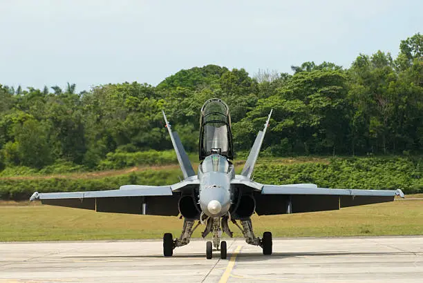 Frontal view of FA-18D Hornet taxiing on runway in Kuala Lumpur, Malaysia.