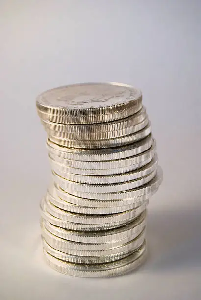 Close-up shot of stacked one ounce silver eagle coins.