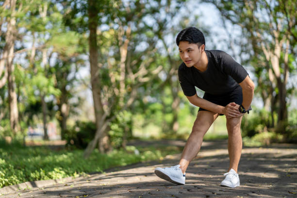 istock Asian man he runs and exercises, he is injured. 1468734633