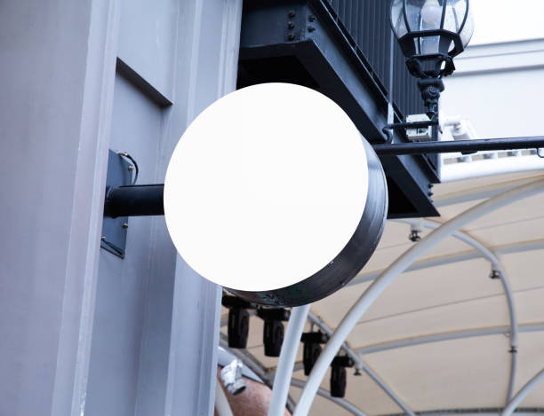 istock Blank white outdoor round signage mockup wall mounted 1468736826
