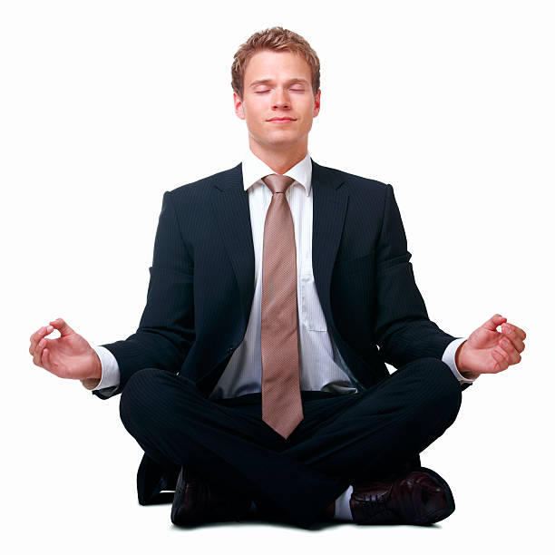 istock Businessman sitting in lotus position against white background 146873765