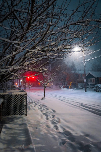 istock City Street in Snow at Night 1468738150