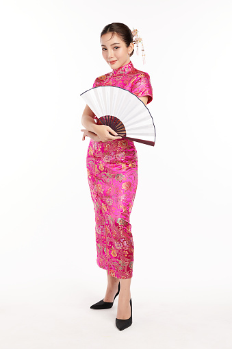 Asian chinese woman in traditional cheongsam qipao dress on white background. Chinese new year festival,