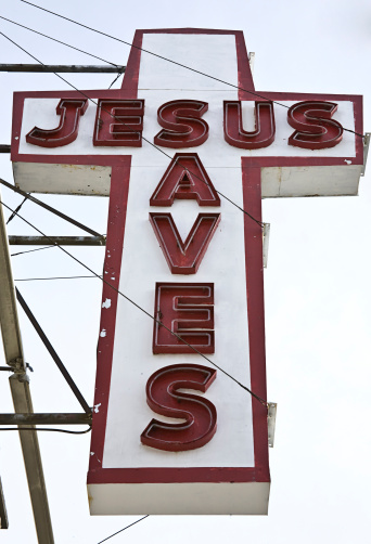 Looking up at sign of Jesus Saves