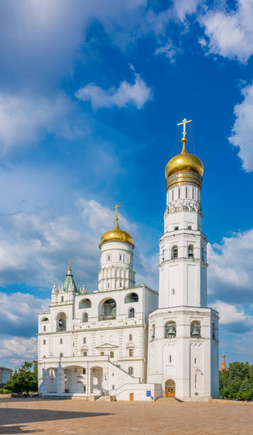 istock Ivan the Great Bell Tower, with Assumption Belfry on the right in Moscow Kremlin. Blue sky background with sunbeams 1468740047