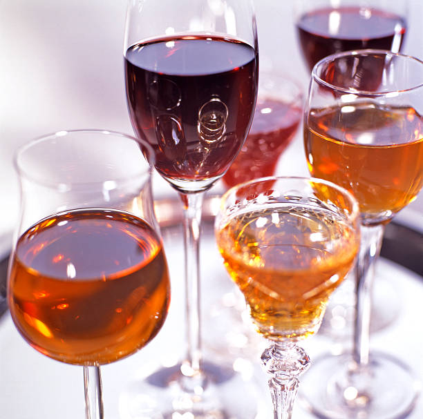 Variety of small wine and sheery glassses in a group stock photo
