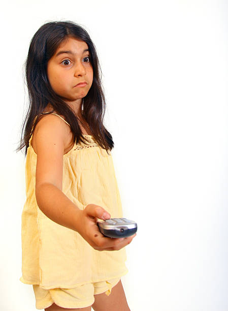 Girl with remote stock photo
