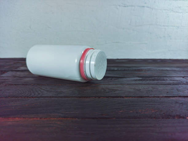 istock bottle from prisipui on a black wooden background 1468742908