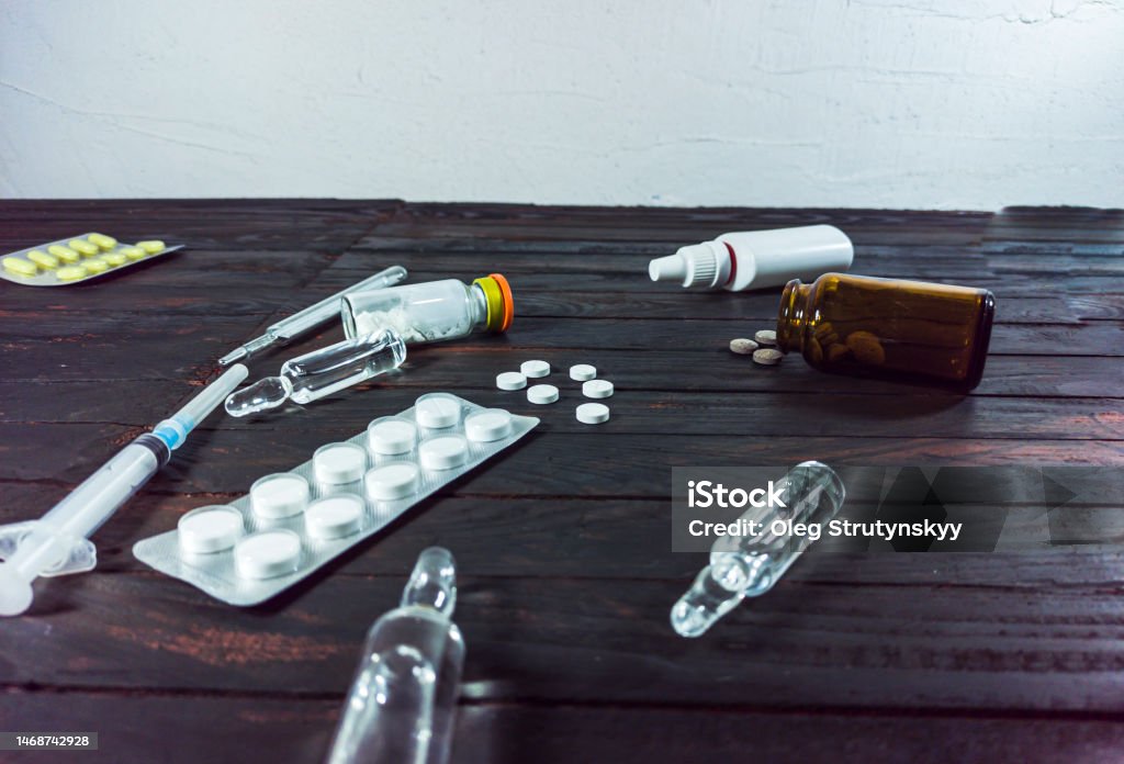 Medical Preparations Laid Out On A Table On A Black Background Ampoules  Pills Drugs For Covid 19 Stock Photo - Download Image Now - iStock