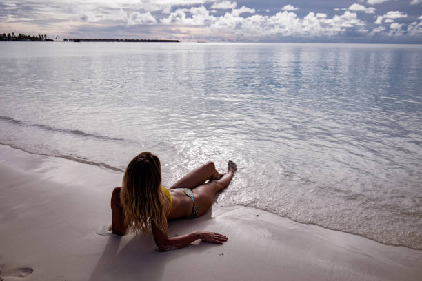 istock Relaxed woman in summer day on the beach. 1468744001