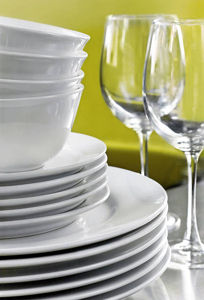 White Plates Bowls and Wine Glasses stock photo