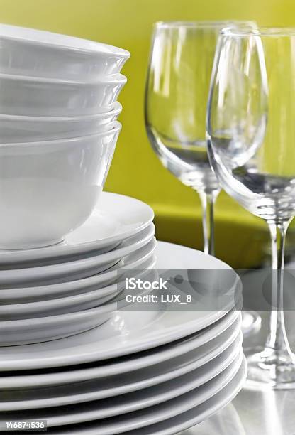 White Plates Bowls And Wine Glasses Stock Photo - Download Image Now - Crockery, Bowl, Ceramics