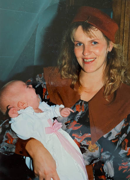 Mother with baby in the eighties stock photo