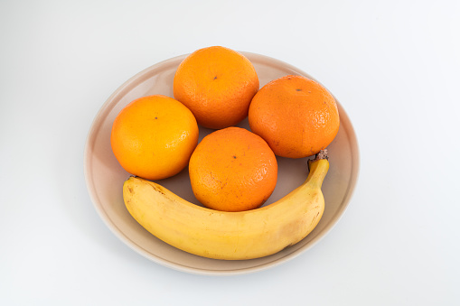 fresh oranges and bananas