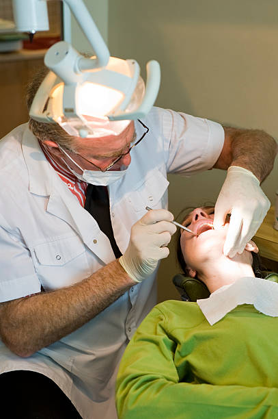 Dentist working stock photo