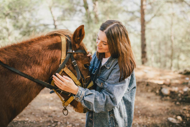 istock A young woman hugging a horse. 1468756415