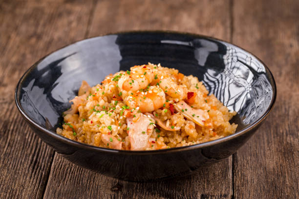 istock Asian seafood fried rice in a black bowl 1468759955